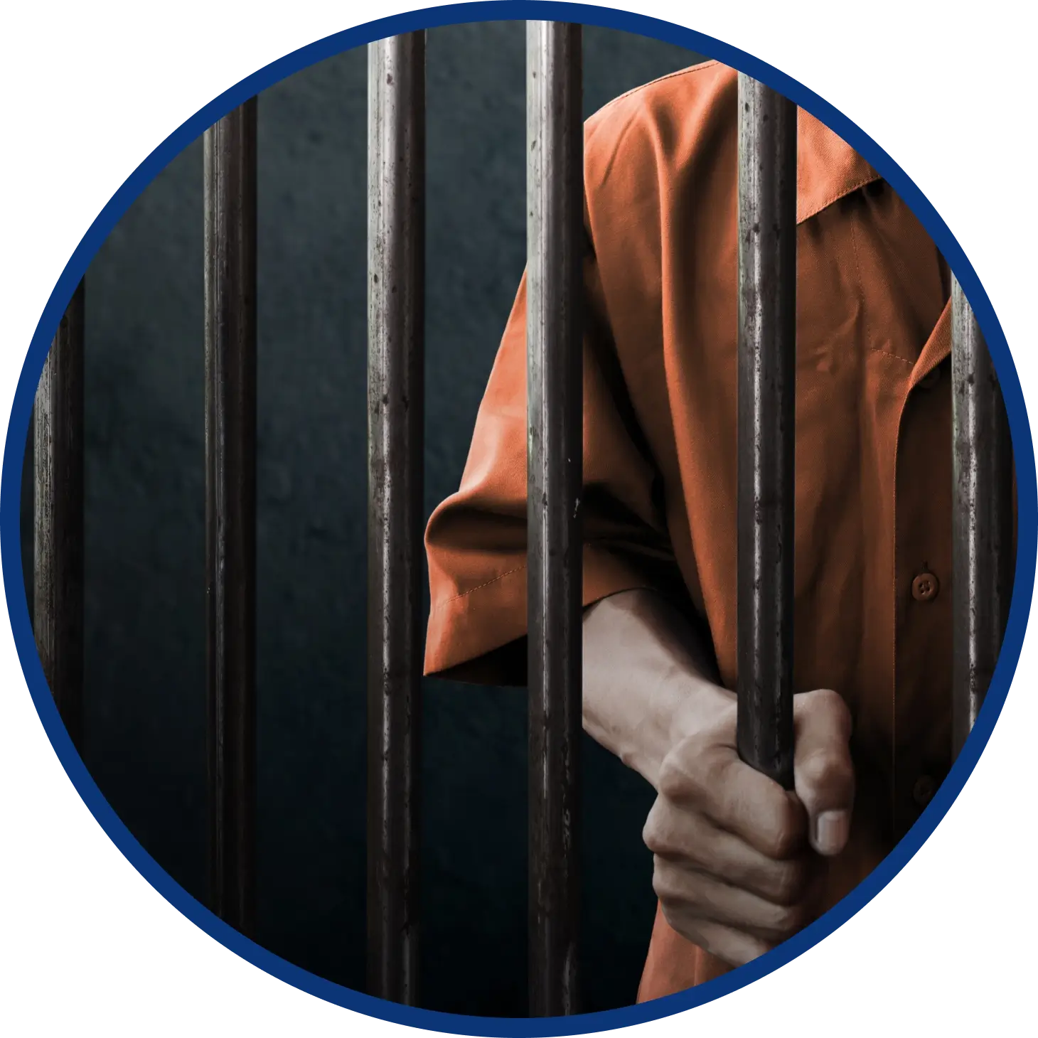Prisoner in orange jumpsuit holding cell bars
